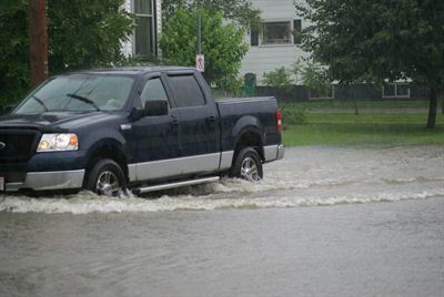 Vehicle driving through flood waters, St. Stephen.