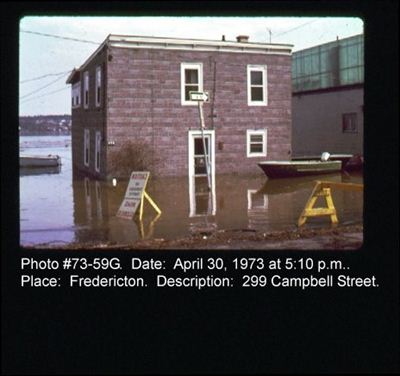Red building flooded on Campbell Street