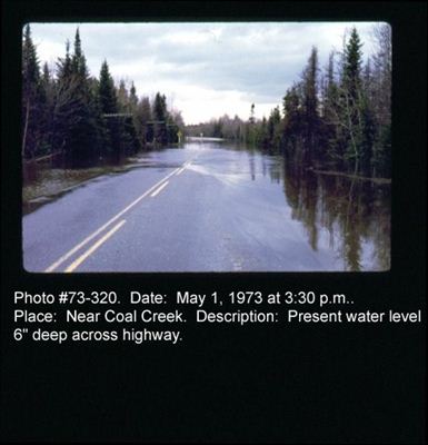 Water 6" deep across highway