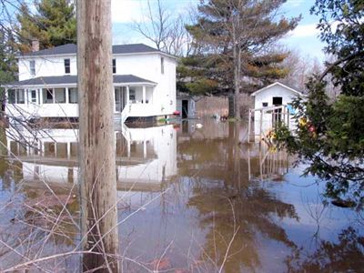 Two storey white house flooded